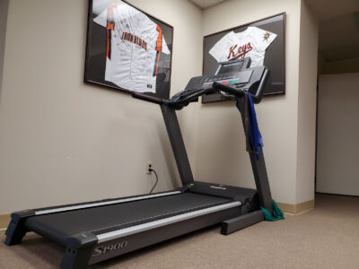 Treadmill and Frederick Keys autographed jerseys at Spine & Sport Annapolis