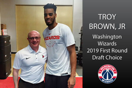 Dr. Ray Infanti with Washington Wizards' Troy Brown, Jr.